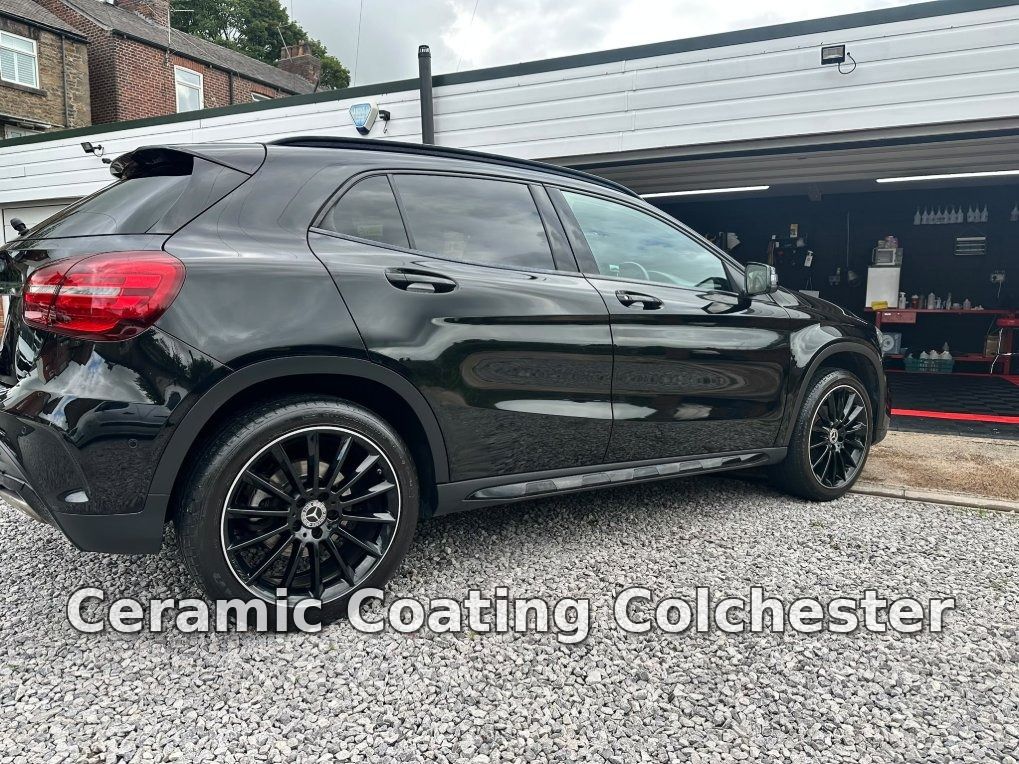 Rear three-quarter view of a black Mercedes-Benz GLA with glossy paintwork
