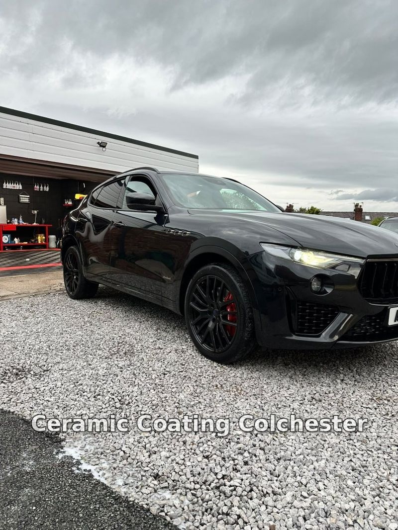 Front three-quarter view of a black Maserati Levante after detailing