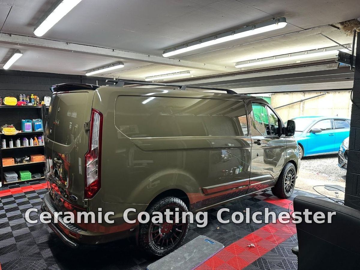 A van parked inside a detailing studio